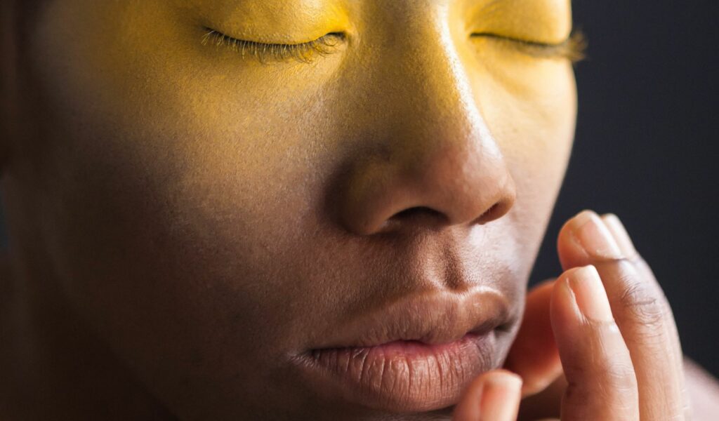 face mapping woman touching her face in post photo